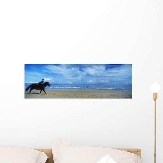 Man Riding A Pony On The Beach Wall Mural
