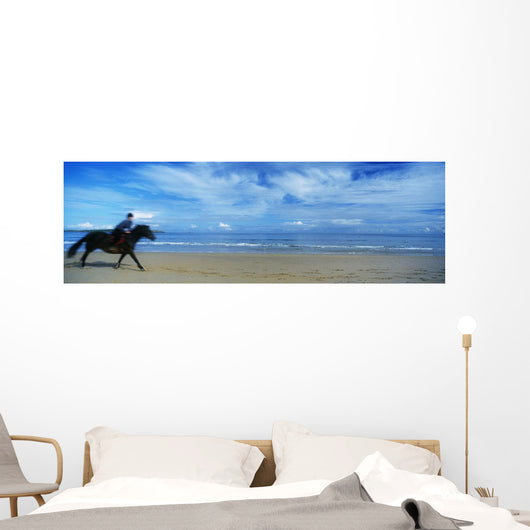 Man Riding A Pony On The Beach Wall Mural