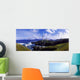 Waves Breaking On The Coast With A Light House In Background Wall Mural