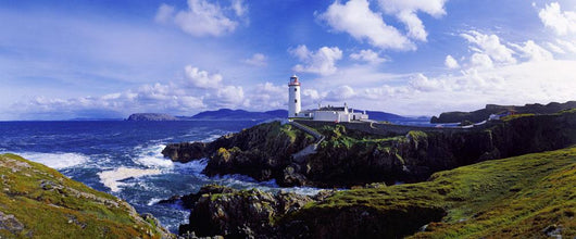Waves Breaking On The Coast With A Light House In Background Wall Mural