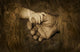Child's Hand Holding Adult Hands Wall Mural