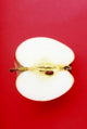 Half An Apple On Red Background Wall Mural