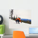 Snowboarder Crouching Down Low As He Descends Snow Hill Wall Mural