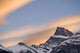 Clouds At Sunset Above Mountain Peaks Wall Mural
