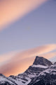Clouds At Sunset Above Mountain Peaks Wall Mural