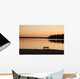 A Bench Silhouetted At Sunset Near The Lake Wall Mural