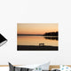 A Bench Silhouetted At Sunset Near The Lake Wall Mural
