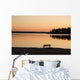 A Bench Silhouetted At Sunset Near The Lake Wall Mural