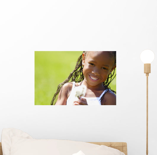 Little Girl Holding Weeds Wall Mural