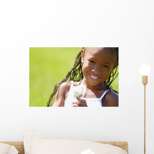 Little Girl Holding Weeds Wall Mural