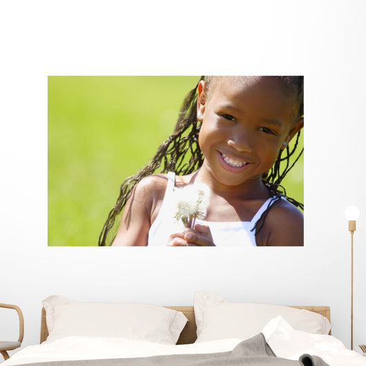 Little Girl Holding Weeds Wall Mural