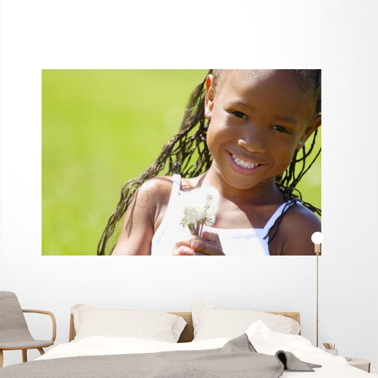 Little Girl Holding Weeds Wall Mural