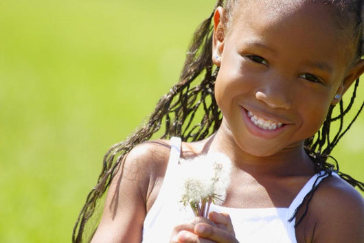 Little Girl Holding Weeds Wall Mural