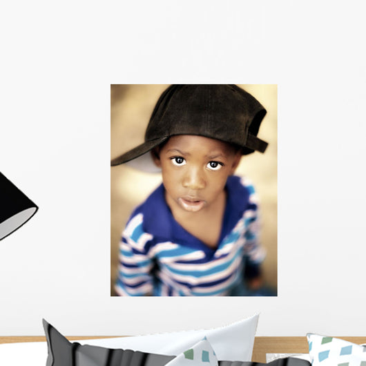 Boy Wearing Over Sized Hat Sideways Wall Mural