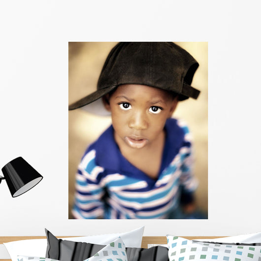 Boy Wearing Over Sized Hat Sideways Wall Mural