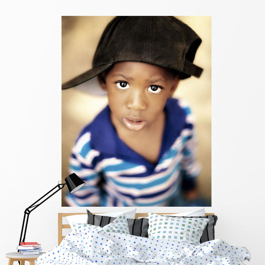 Boy Wearing Over Sized Hat Sideways Wall Mural