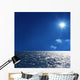 a background image of an open sea and blue sky Wall Mural