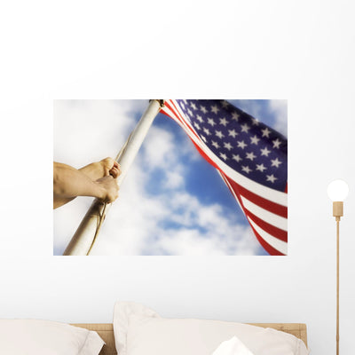 Raising American Flag Wall Mural shown on a wall