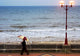 Lady With An Umbrella Walking Along Bridlington Prom Wall Mural