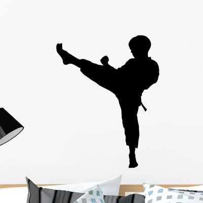 Boy Karate Kick Silhouette Wall Decal shown on a wall
