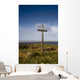 Grave Site Marked By A Cross On A Hill Wall Mural