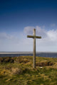 Grave Site Marked By A Cross On A Hill Wall Mural