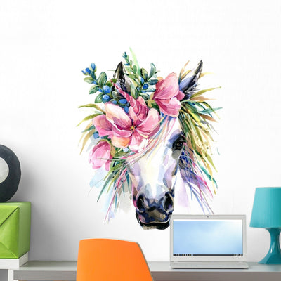 Pink Floral Watercolor Unicorn Wall Decal shown on a wall