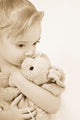 Girl Kissing Her Stuffed Animal Wall Mural