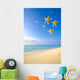 Starfish Falling In Front Of The Ocean Wall Mural
