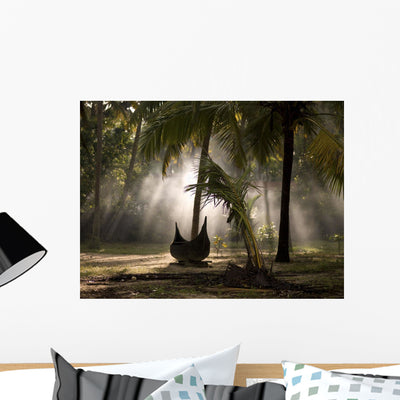 Canoe under Palm Trees Wall Mural shown on a wall