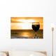 Glass of wine on the beach Wall Mural