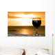 Glass of wine on the beach Wall Mural