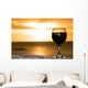 Glass of wine on the beach Wall Mural