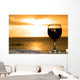 Glass of wine on the beach Wall Mural