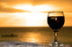 Glass of wine on the beach Wall Mural