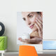 young woman smiling face care cream Wall Mural