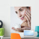 young woman smiling face care cream Wall Mural
