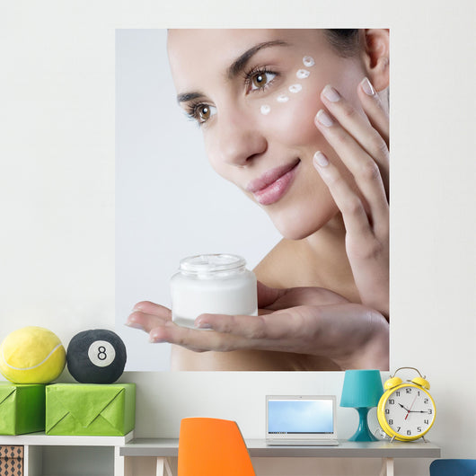 young woman smiling face care cream Wall Mural