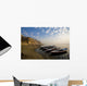 Boats Moored On River In A Row Outside City Wall Mural