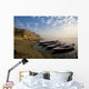 Boats Moored On River In A Row Outside City Wall Mural