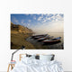 Boats Moored On River In A Row Outside City Wall Mural