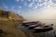 Boats Moored On River In A Row Outside City Wall Mural