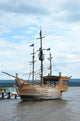 Pirate style ship setting sail on the high seas Wall Mural