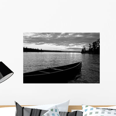 Abandoned Canoe Floating Water Wall Mural shown on a wall