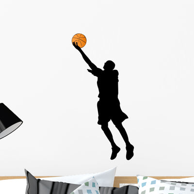 Basketball Player Silhouette Wall Decal shown on a wall