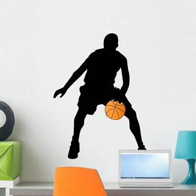 Basketball Player Silhouette Wall Decal shown on a wall