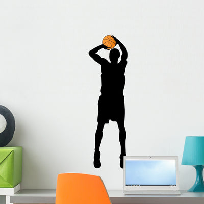 Basketball Player Silhouette Wall Decal shown on a wall