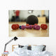 Dumbbells and ball on the floor of a fitness room Wall Mural