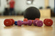 Dumbbells and ball on the floor of a fitness room Wall Mural