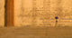 Woman Carrying Bundle On Her Head On The Ghats By The River Wall Mural